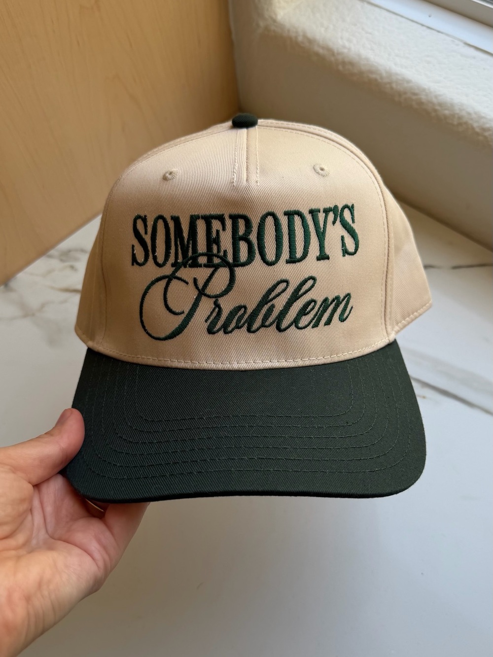 Somebody’s Problem Trucker Hat